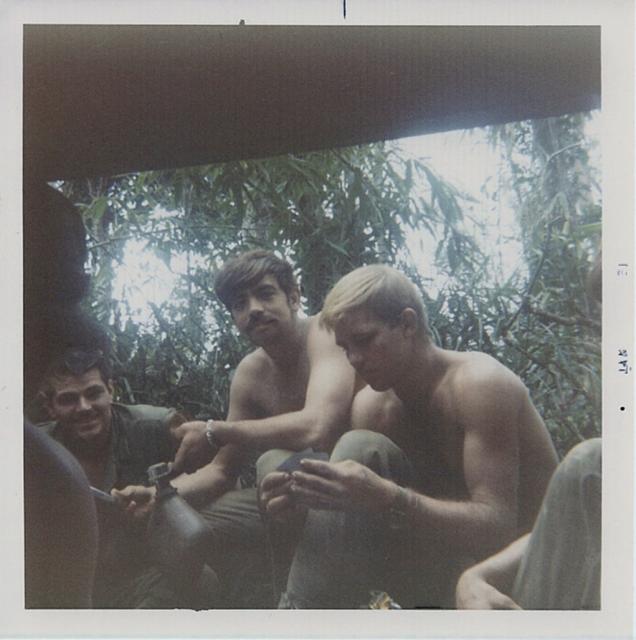 Playing cards in the field, waiting on orders. We did that a lot!!!