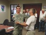 In his hand-shake, he presents each of us with one of their "Challenge Coins" 